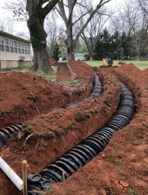 New drainage lines installed in a septic system drainfield